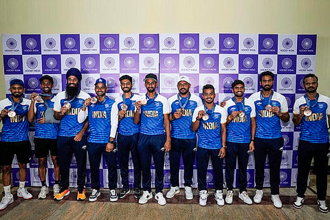 Bronze medalist Indian Hockey players pose for photos at Major Dhyan Chand National Stadium